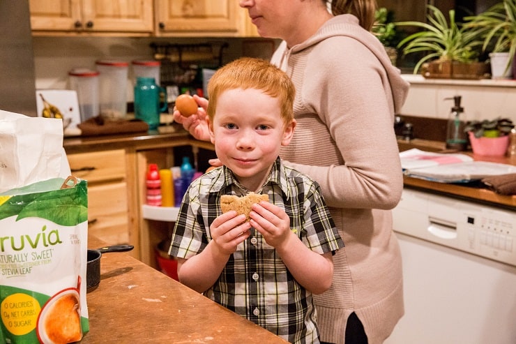 Adorable child eating a snickerdoodle cookie