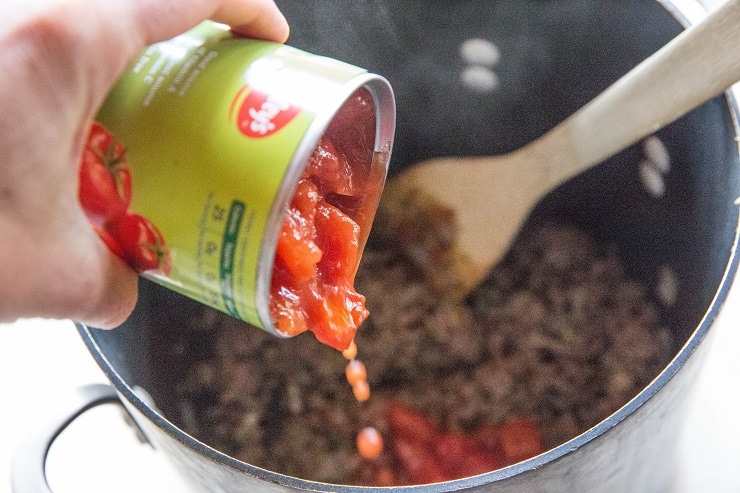 Stir in the diced tomatoes and chicken broth