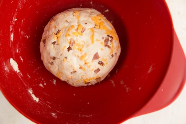 A ball of biscuit dough in the mixing bowl