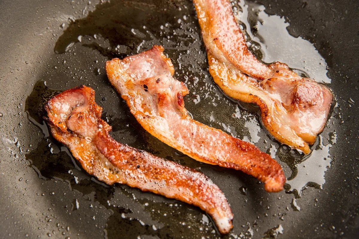 Bacon cooking in a skillet