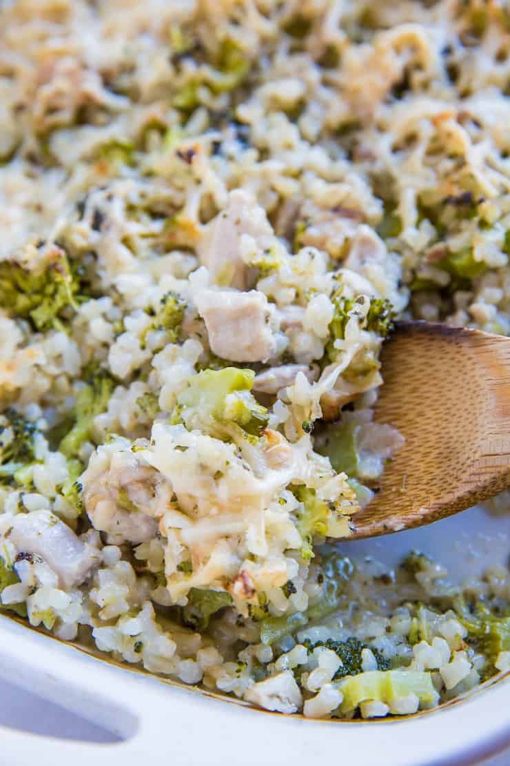 close up photo of chicken casserole with wooden spoon