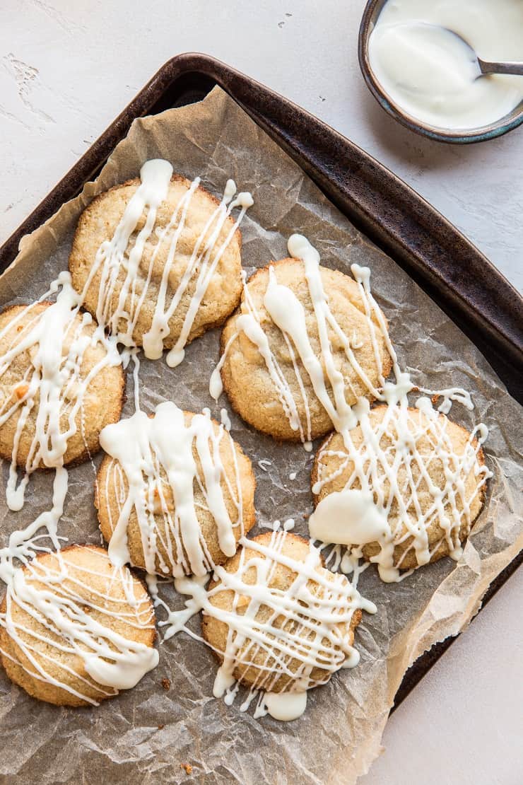 Top down photo of a tray of paleo white chocolate macadamia nut cookies