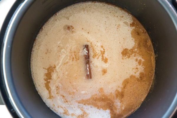 All of the ingredients for easy rice pudding in a pressure cooker.