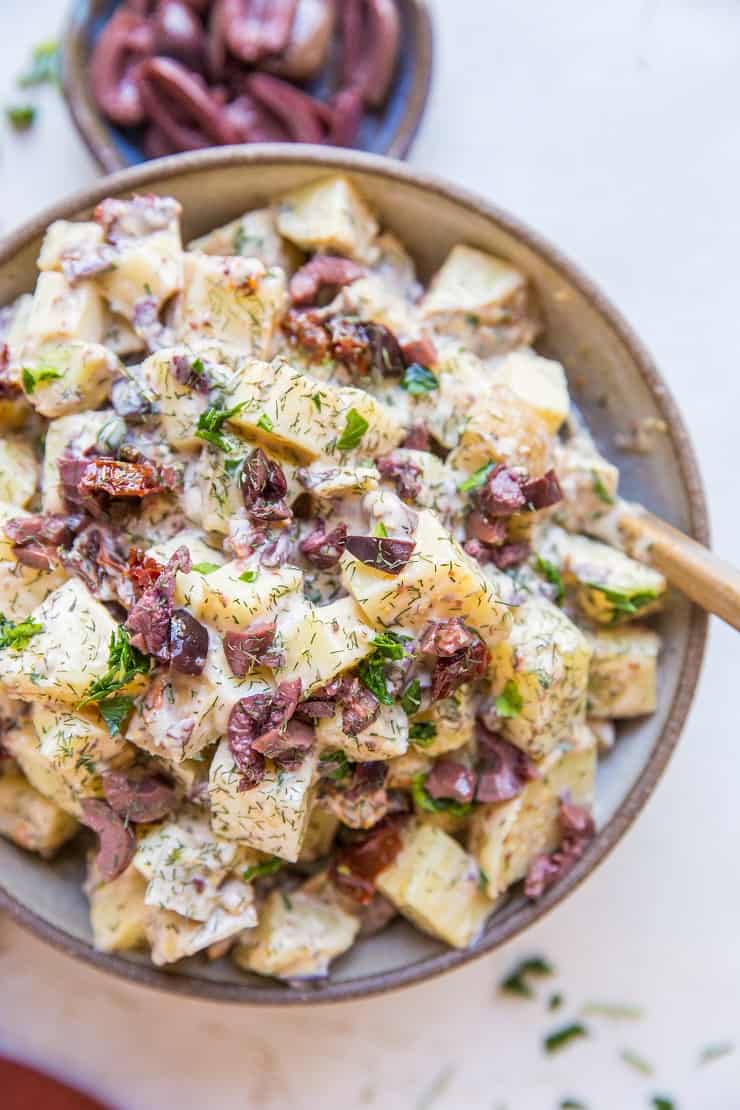 Greek Potato Salad - a healthier potato salad recipe with cider vinaigrette, sun-dried tomatoes, kalamata olives, dill and parsley - an amazing side dish recipe for picnics and BBQs