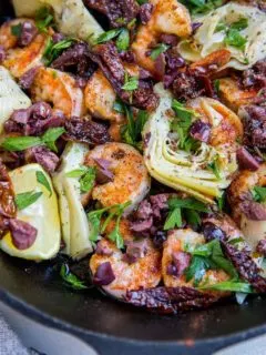 Mediterranean Shrimp with sun-dried tomatoes, artichoke hearts, kalamata olives and parsley - an easy one-skillet meal