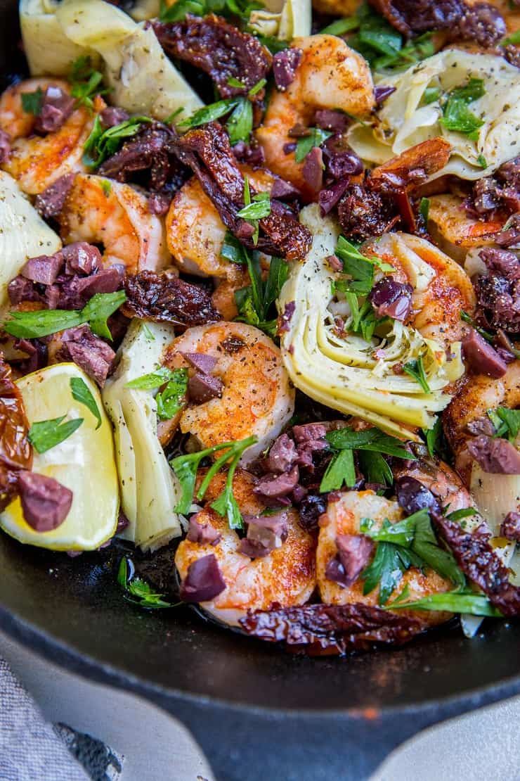 Mediterranean Shrimp with sun-dried tomatoes, artichoke hearts, kalamata olives and parsley - an easy one-skillet meal