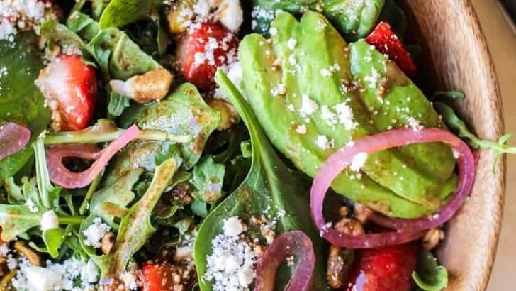Close up shot of arugula spinach strawberry salad with strawberry vinaigrette