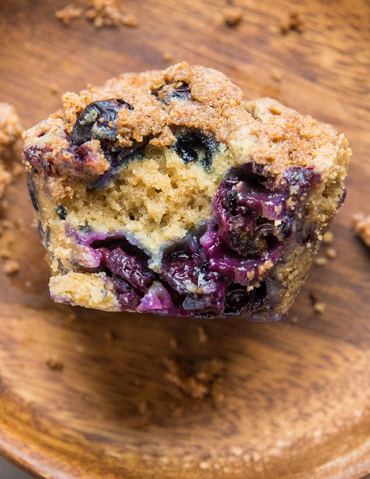 close up of blueberry sourdough muffin with bite taken out