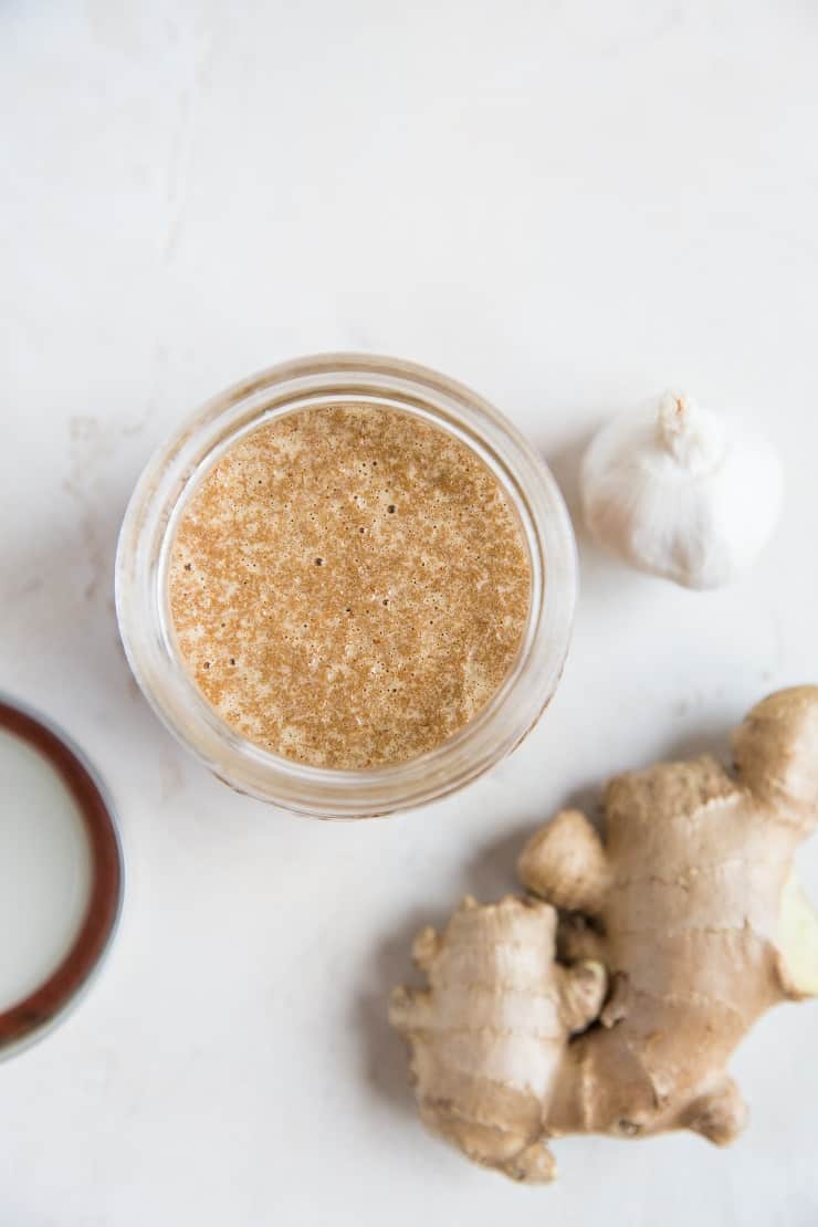 Top down photo of easy stir fry sauce with ginger and garlic next to the jar