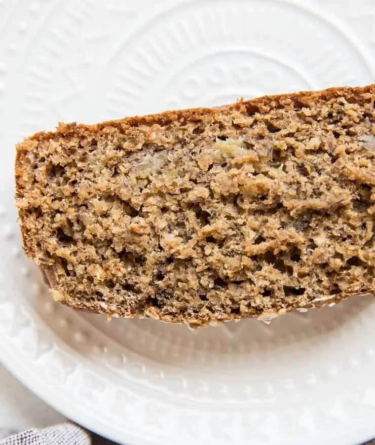 close up top down photo of slice of moist banana bread
