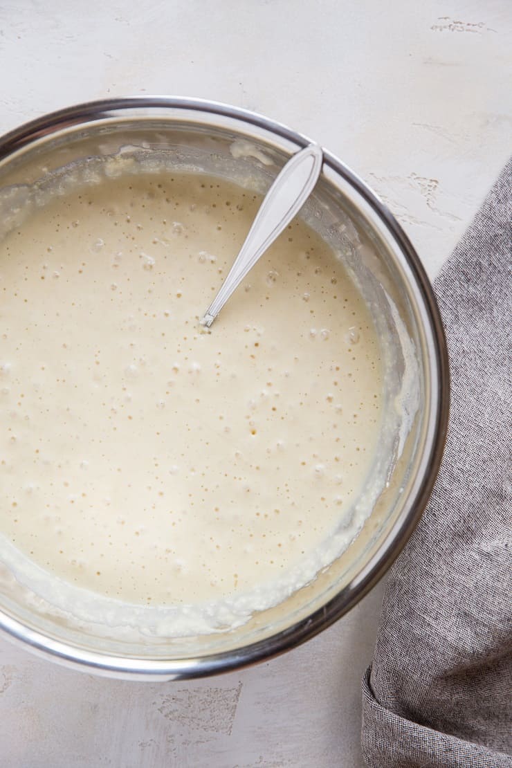 Bubbly Sourdough Waffle Batter in a stainless steel mixing bowl