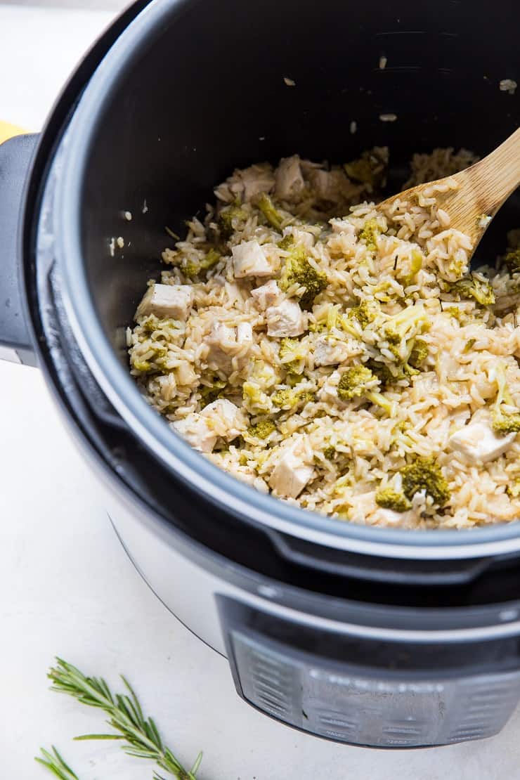 Pressure cooker with Rosemary Lemon Instant Pot Chicken and Rice in it