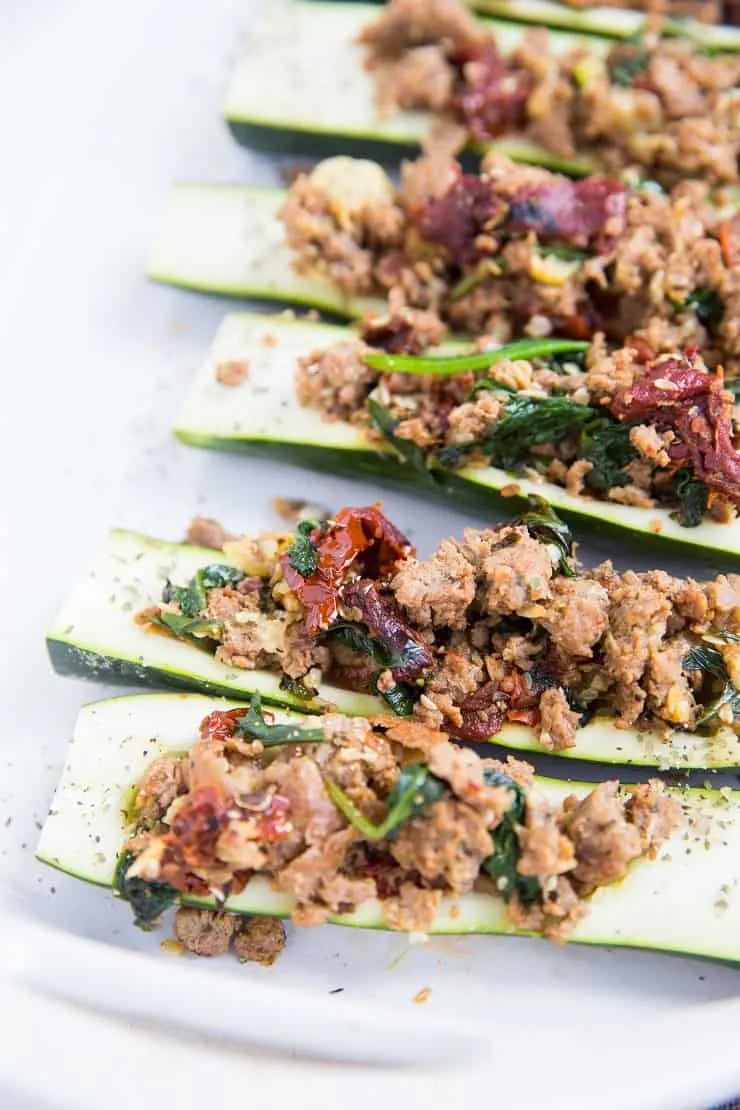 Stuffed Zucchini with Turkey Italian Sausage, Sun-Dried Tomatoes, and Spinach - a clean, healthy paleo and keto dinner recipe!