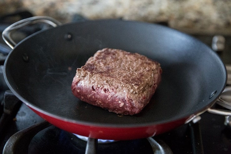 1 pound of ground beef browning in a skillet