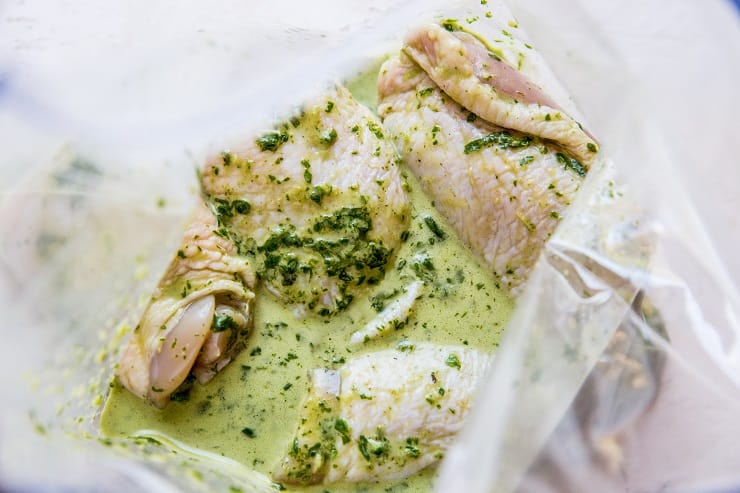 Chicken marinating in basil marinade