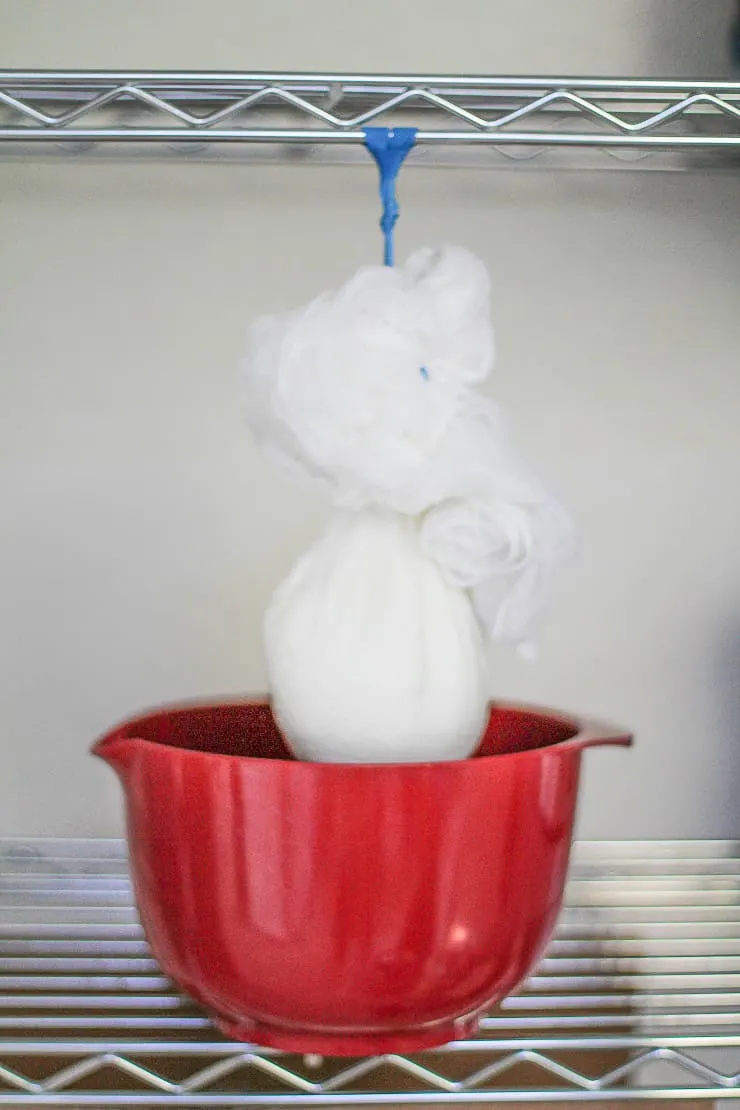 straining whey from yogurt using cheesecloth
