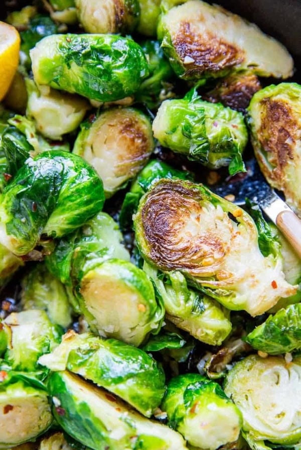Sauteed brussel sprouts recipe with garlic and butter. This quick and easy brussel sprout recipe is low-carb, keto, paleo, will be a home run with your friends and family each and every time!