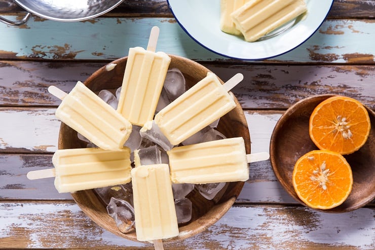 Orange Creamsicle Popsicles made with 2 ingredients. Healthy, vegan, paleo, creamy delicious no-bake dessert recipe