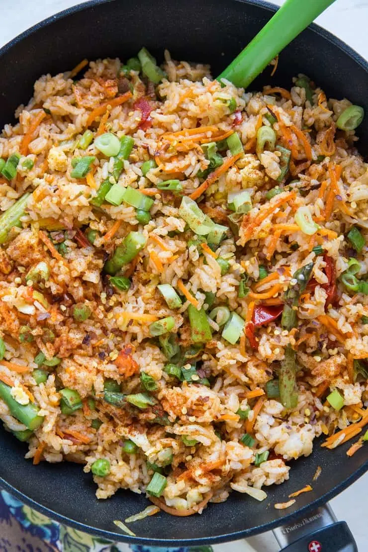 Vegetable Red Curry Fried Rice - Thai style fried rice with red curry paste, bell pepper, carrot, asparagus, green onion, and more