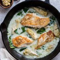 Creamy Chicken with Spinach Artichoke Sauce - an easy, healthy dinner recipe that is paleo, keto, whole30 and delicious!