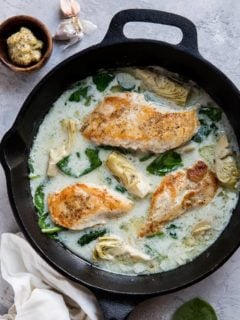 Creamy Chicken with Spinach Artichoke Sauce - an easy, healthy dinner recipe that is paleo, keto, whole30 and delicious!