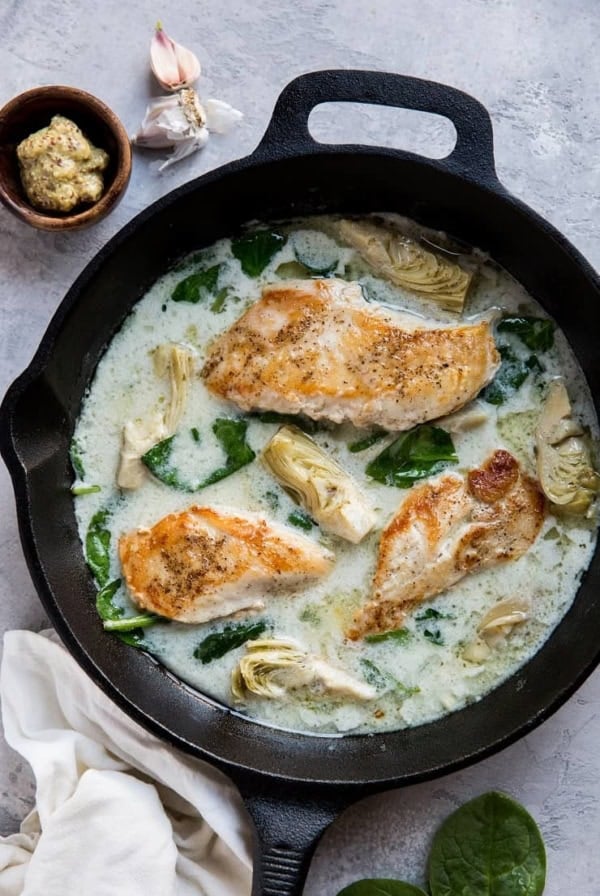 Creamy Chicken with Spinach Artichoke Sauce - an easy, healthy dinner recipe that is paleo, keto, whole30 and delicious!