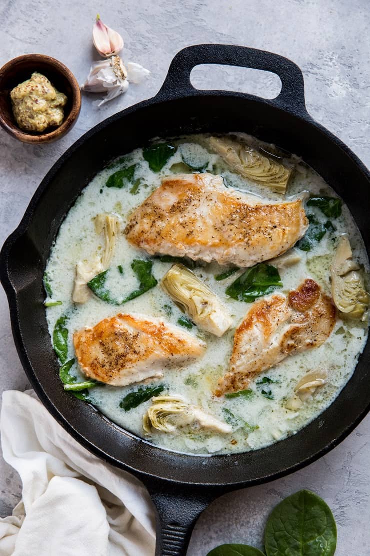 Creamy Chicken with Spinach Artichoke Sauce - an easy, healthy dinner recipe that is paleo, keto, whole30 and delicious!