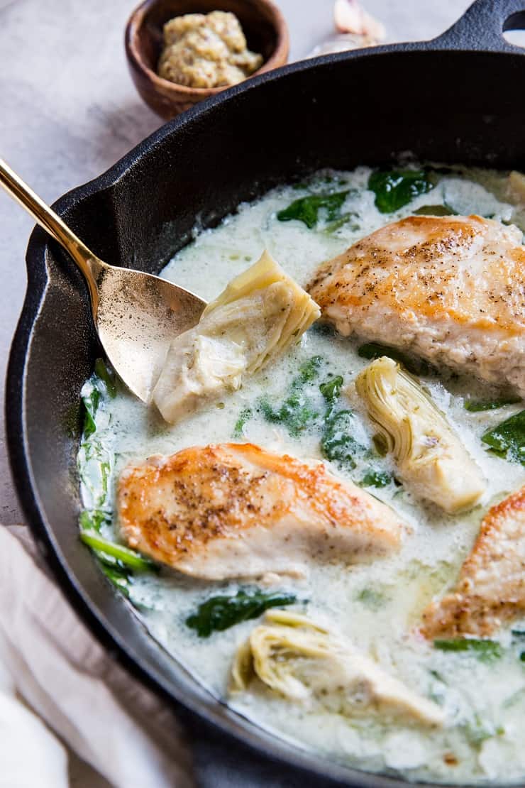 Pan-Cooked Chicken with Creamy Spinach Artichoke Sauce - a healthy dinner recipe that is gluten-free, paleo, keto, whole30 and delicious