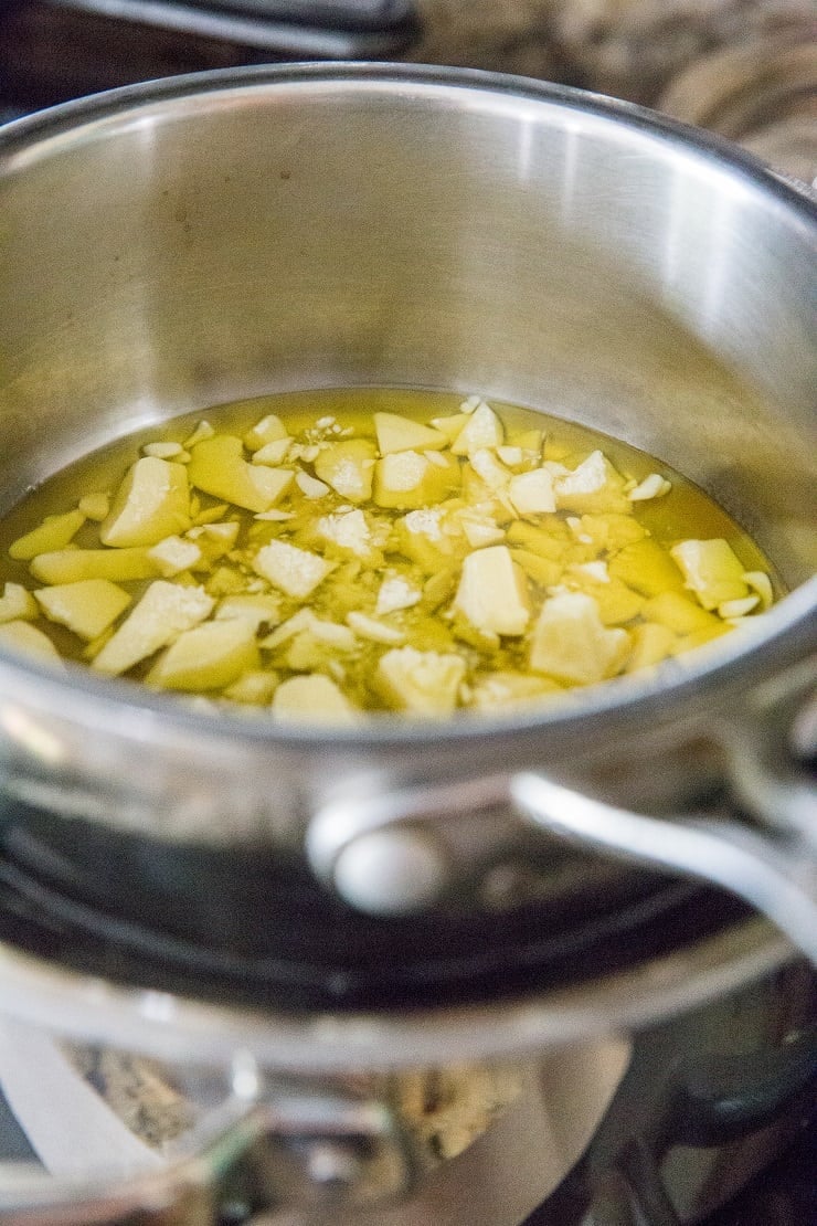 Melt cacao butter in a double boiler to make homemade chocolate