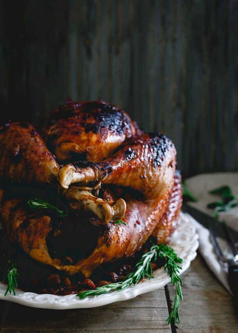 Tart Cherry Cranberry Glazed Turkey from Running to the Kitchen - A changeup from the ye old classic flavors, this recipe is ultra enticing and a unique Thanksgiving turkey recipe! The slightly sweet and sticky glaze gives the bird tons of festive flavor! 