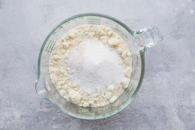 Ingredients for almond flour pie crust in a measuring cup for prep