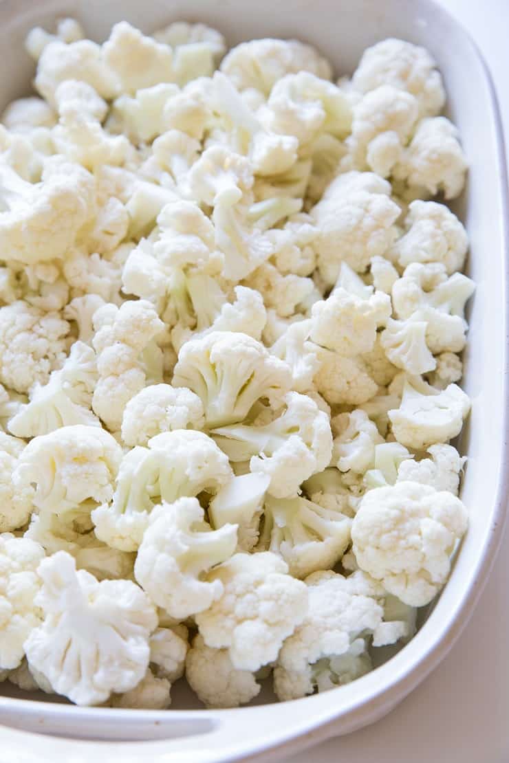 raw cauliflower in a casserole dish for casserole