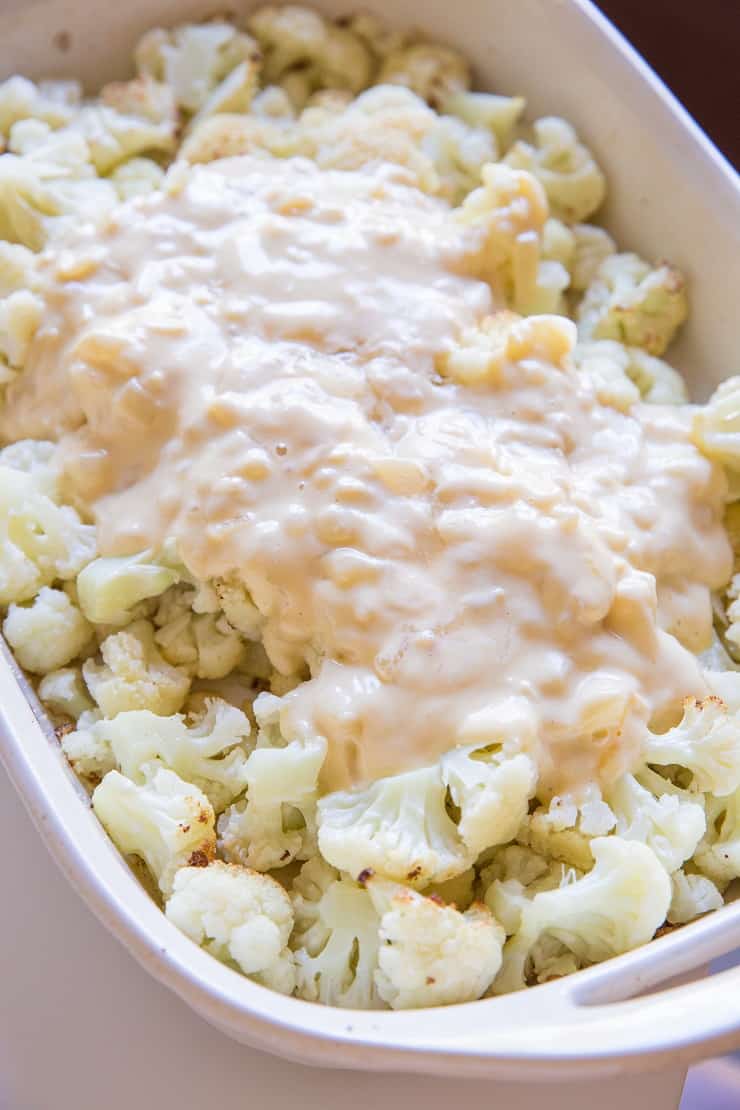 Creamy sauce poured on roasted cauliflower