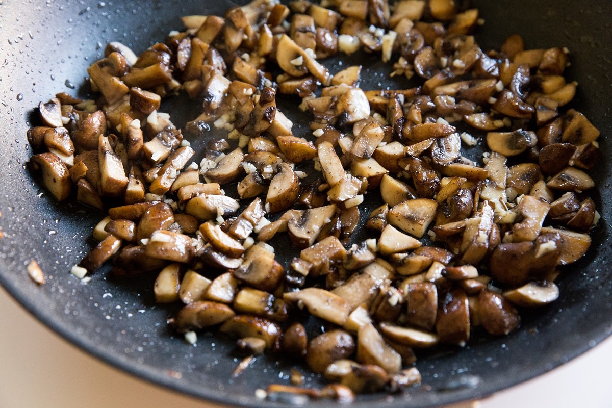 Mushrooms cooking in a skillet