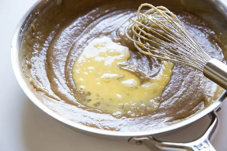 Whisk the beaten egg into the cooled caramel
