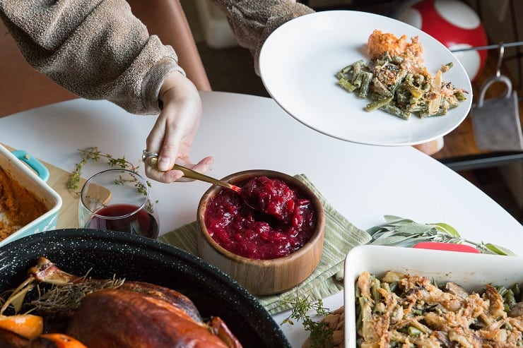 Maple Bourbon Cranberry Sauce is a lovely addition to your Thanksgiving Feast! Full of cinnamon and orange zest flavors, this naturally sweetened cranberry sauce recipe is amazing