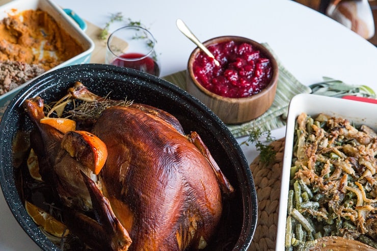 Maple Bourbon Cranberry Sauce is a lovely addition to your Thanksgiving Feast! Full of cinnamon and orange zest flavors, this naturally sweetened cranberry sauce recipe is amazing