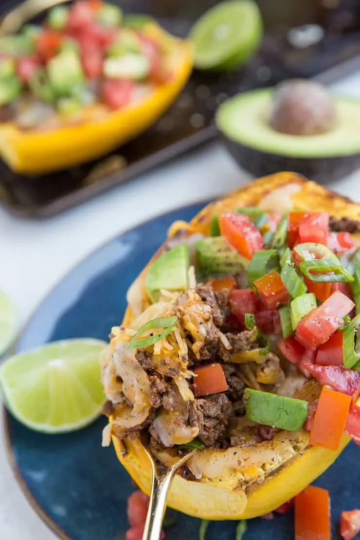 Keto Low-Carb Burrito Bowls with spaghetti squash, ground beef, cheese, salsa, avocado and more! 
