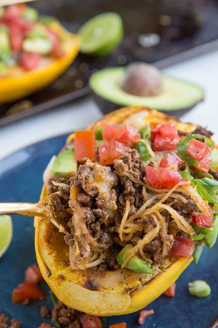 Low-Carb Burrito Bowls made keto friendly with spiced ground beef, avocado, tomato, cheese, and green onion