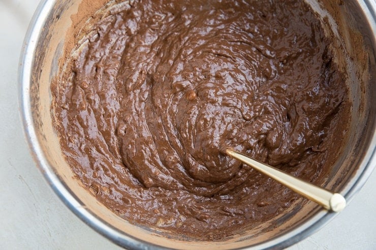 Flourless brownie batter in a mixing bowl