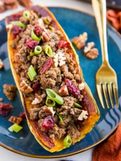 Stuffed Delicata Squash with Ground Beef, Cranberries and Pecans is a healthy dinner recipe that is paleo, whole30 and nutritious. Plus, it's easy to make!