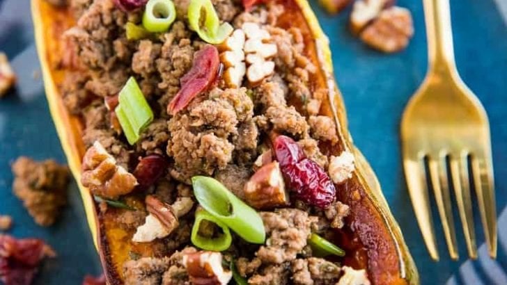 Stuffed Delicata Squash with Ground Beef, Cranberries and Pecans is a healthy dinner recipe that is paleo, whole30 and nutritious. Plus, it's easy to make!