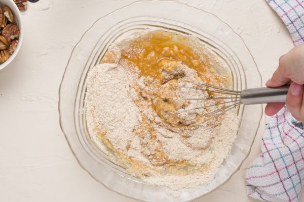 Hand mixing together the batter for the coffee cake.