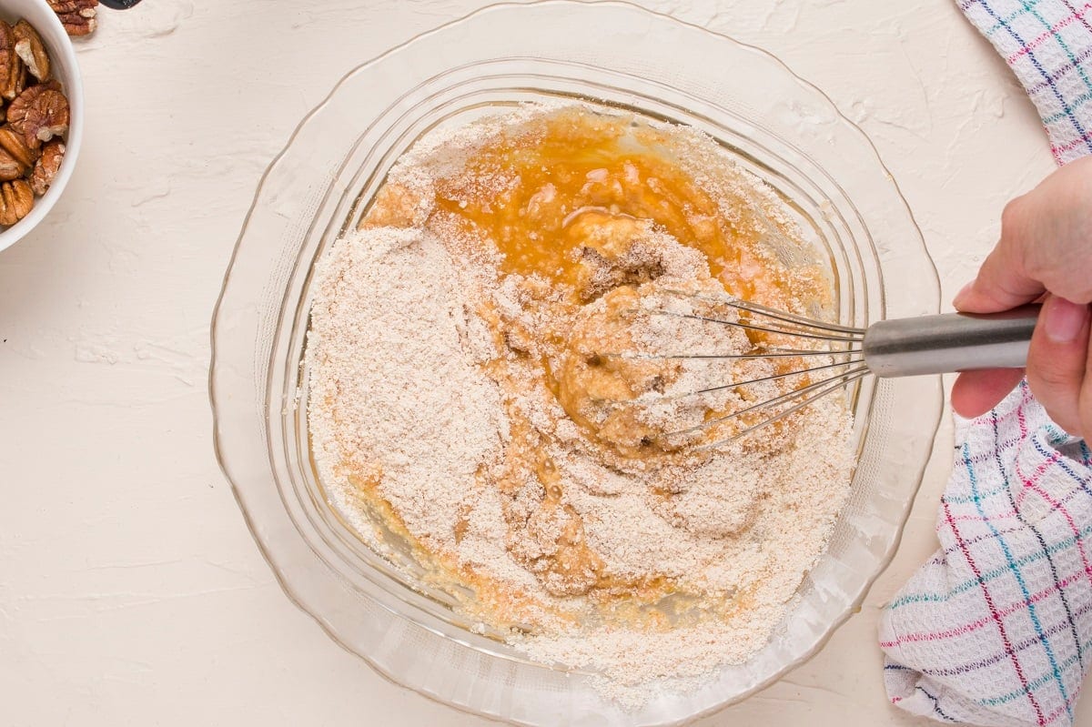 Hand mixing together the batter for the coffee cake.