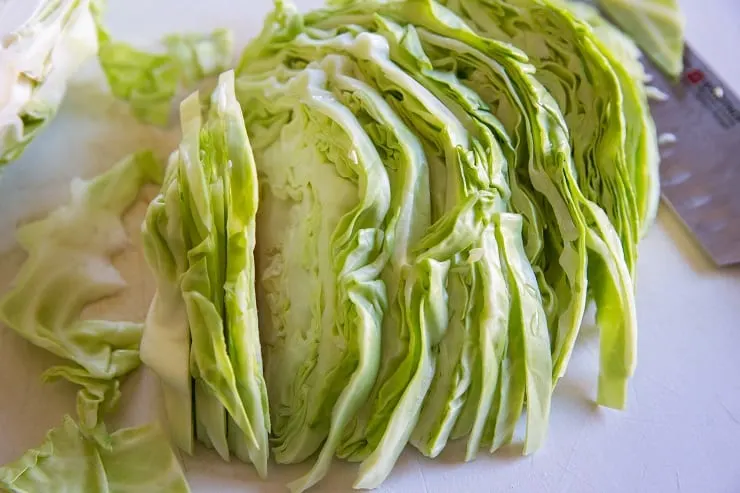 Slice the cabbage and remove tough inner core