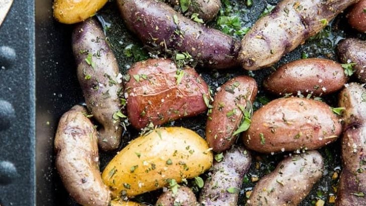 Garlic Roasted Potatoes - an easy recipe for herby garlicky fingerling potatoes with the perfect crisp. A delightful side dish to any meal!