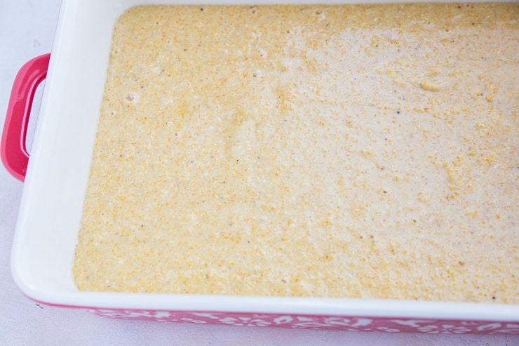 Pour cornbread batter into a large casserole dish