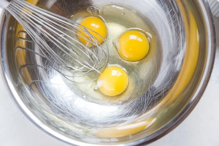 Eggs in a mixing bowl to make biscuits