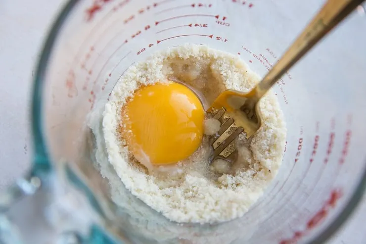 Stir in the egg yolk and coconut oil