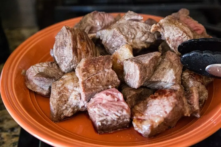 Transfer browned meat to a plate